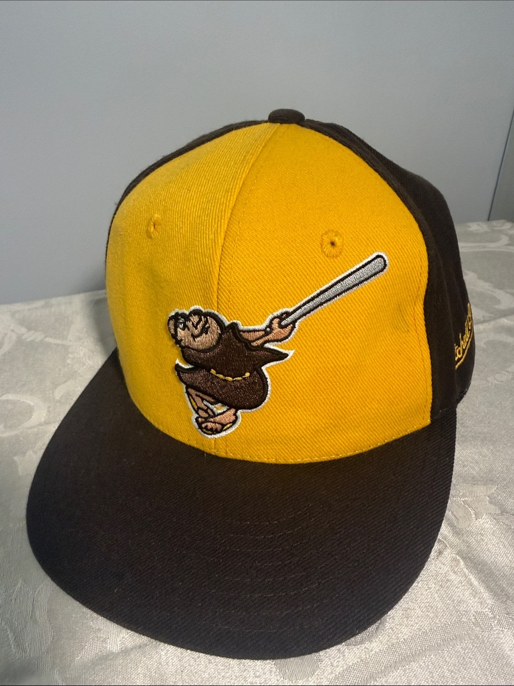 Yellow and Brown Baseball Cap with Embroidered Batter Logo